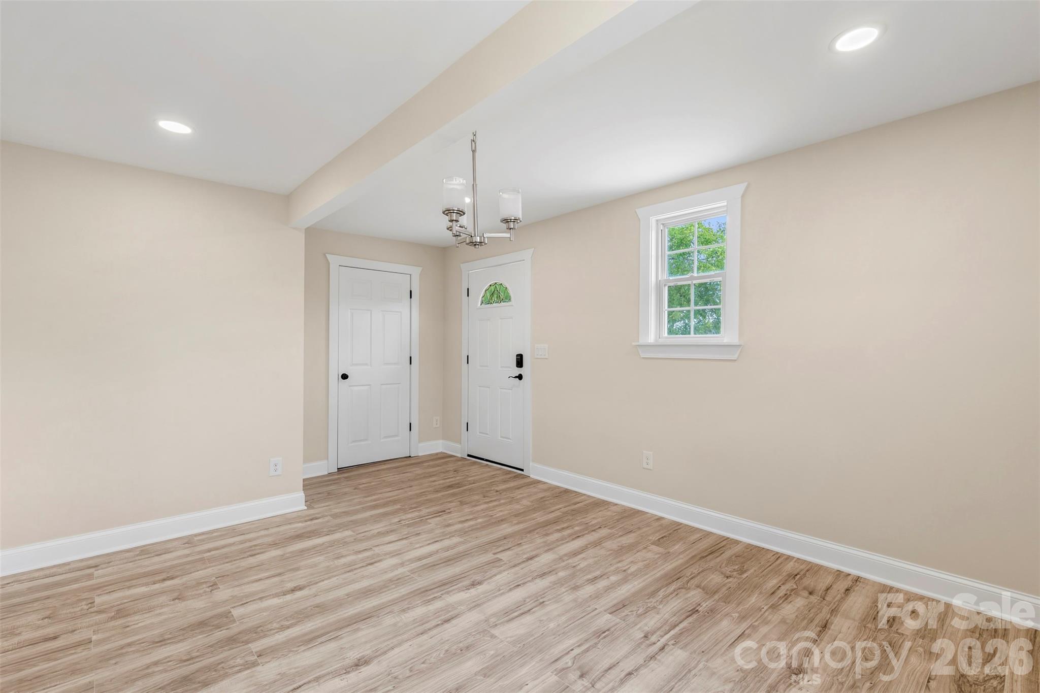 2480 Artz Road Salisbury, NC 28146 - Photo 24 of 33 wooden floor in an empty room with a window