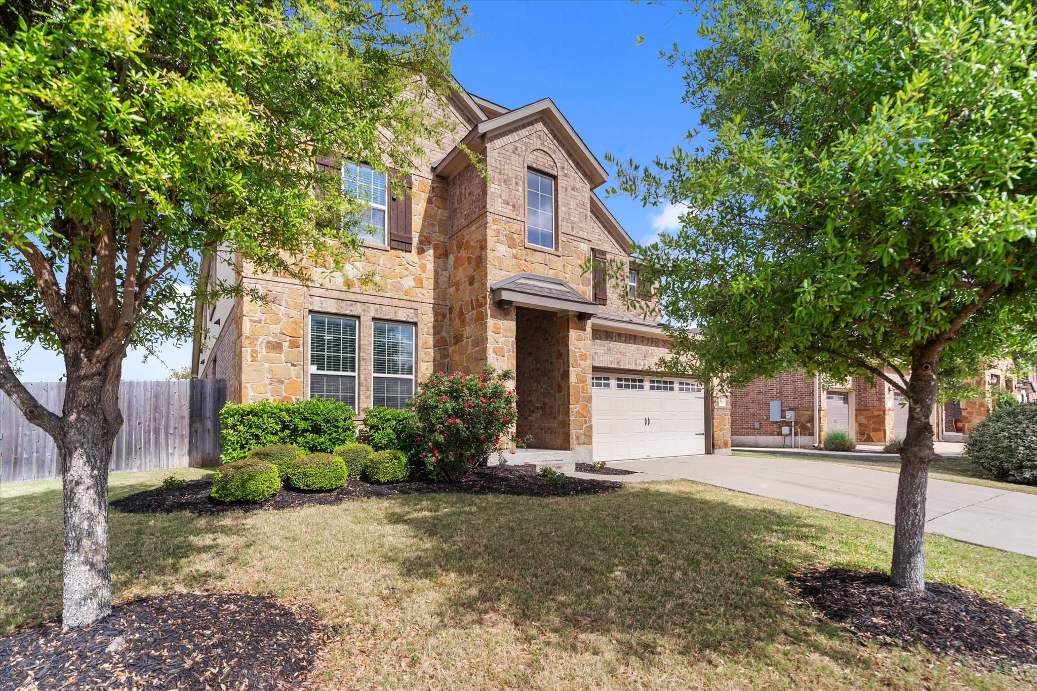 2300 Centennial Loop Round Rock, TX 78665 - Photo 2 of 40 The striking stone and brick exterior creates timeless curb appeal on this spacious corner lot.
