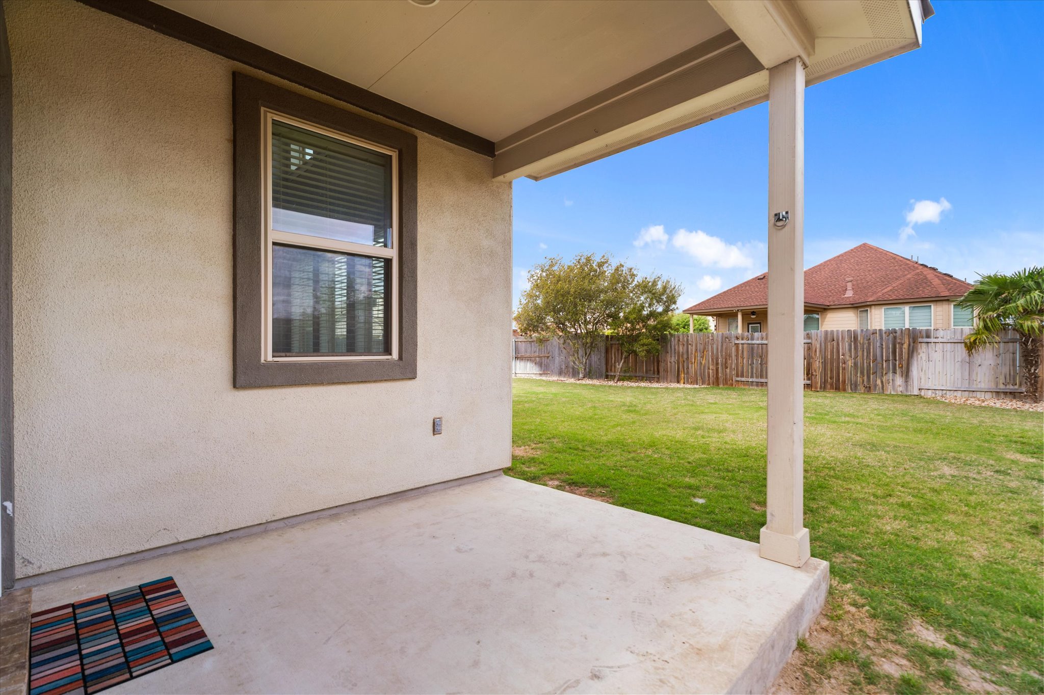2300 Centennial Loop Round Rock, TX 78665 - Photo 32 of 40 The covered back patio offers a relaxing outdoor space to unwind and enjoy the fresh air.