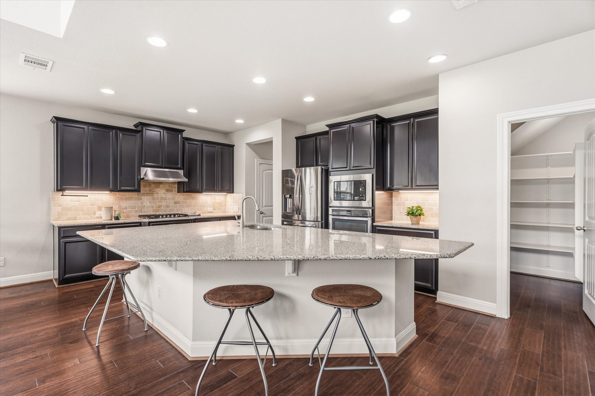 2300 Centennial Loop Round Rock, TX 78665 - Photo 9 of 40 The spacious kitchen features abundant cabinetry and generous counter space for everyday cooking.
