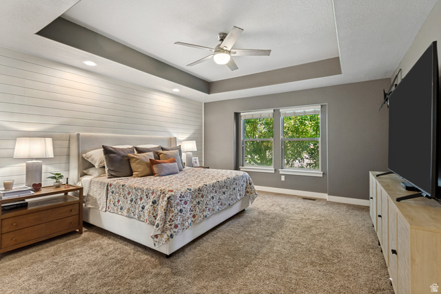 40 Wheeler Road Heber City, UT 84032 - Photo 12 of 41 Tray ceiling with recessed lighting, ceiling fan, shiplap accent wall, and dual windows