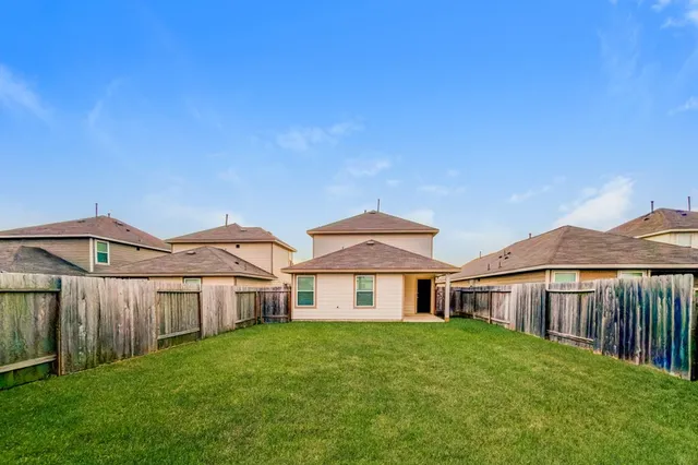 a front view of a house with yard and porch