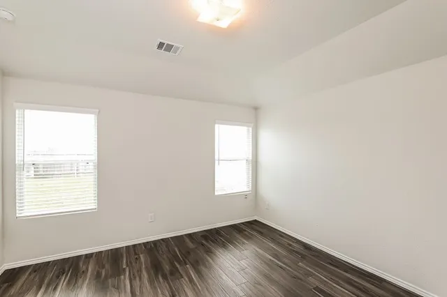 an empty room with windows