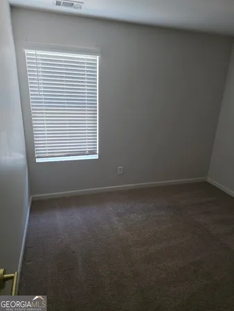 a view of a room that has a window in it