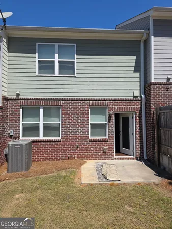 a view of a brick house with a large windows