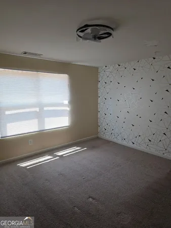 a view of an empty room and window