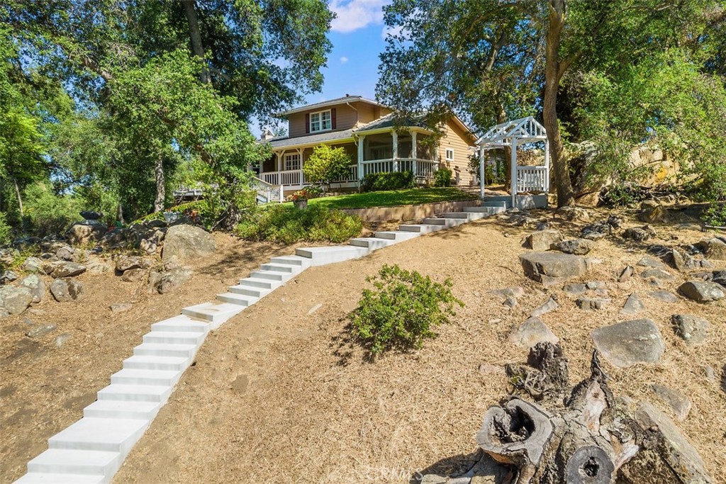 35455 El Niguel Road Lake Elsinore, CA 92530 - Photo 11 of 58 a front view of a house with a yard