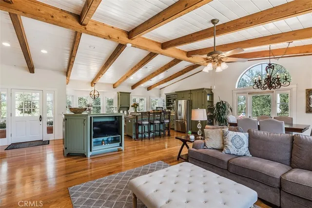 a kitchen with a table chairs stove and cabinets