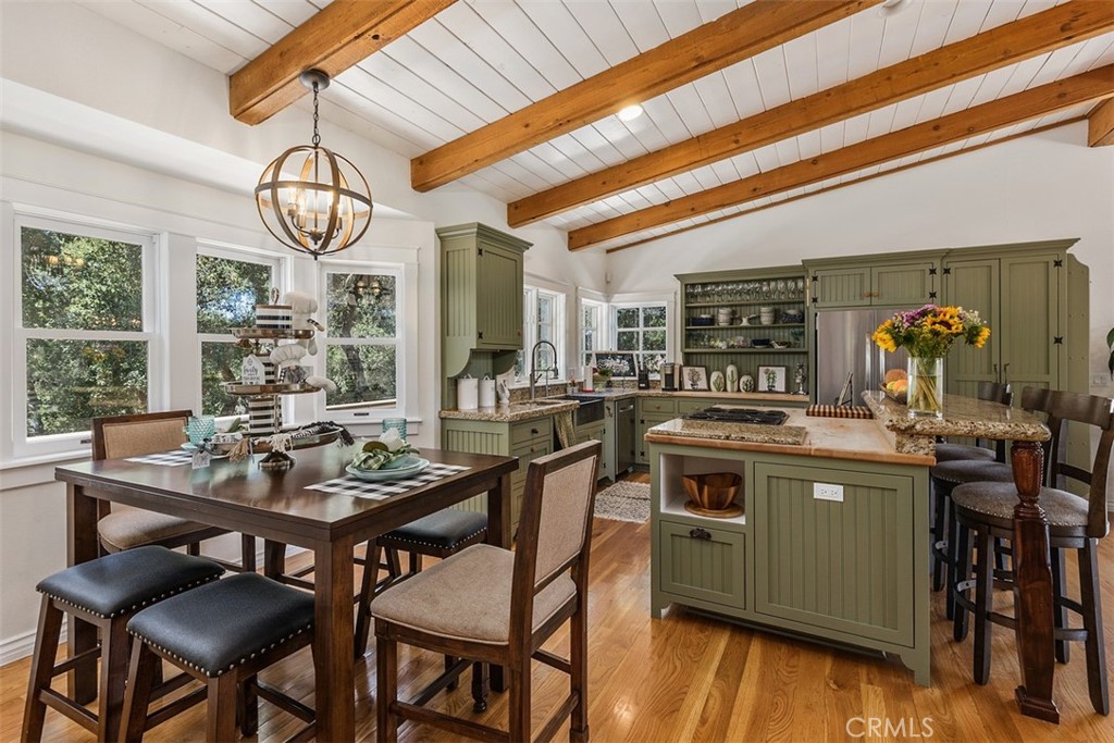35455 El Niguel Road Lake Elsinore, CA 92530 - Photo 27 of 58 a kitchen with a table chairs stove and cabinets