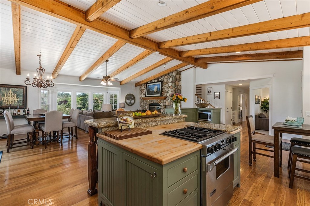 35455 El Niguel Road Lake Elsinore, CA 92530 - Photo 29 of 58 a kitchen with a stove and a dining table