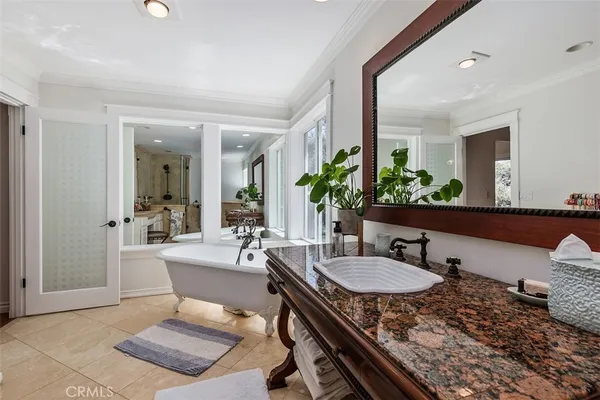 a bathroom with a sink double vanity and a mirror