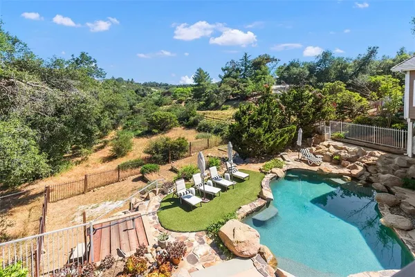a view of a house with swimming pool