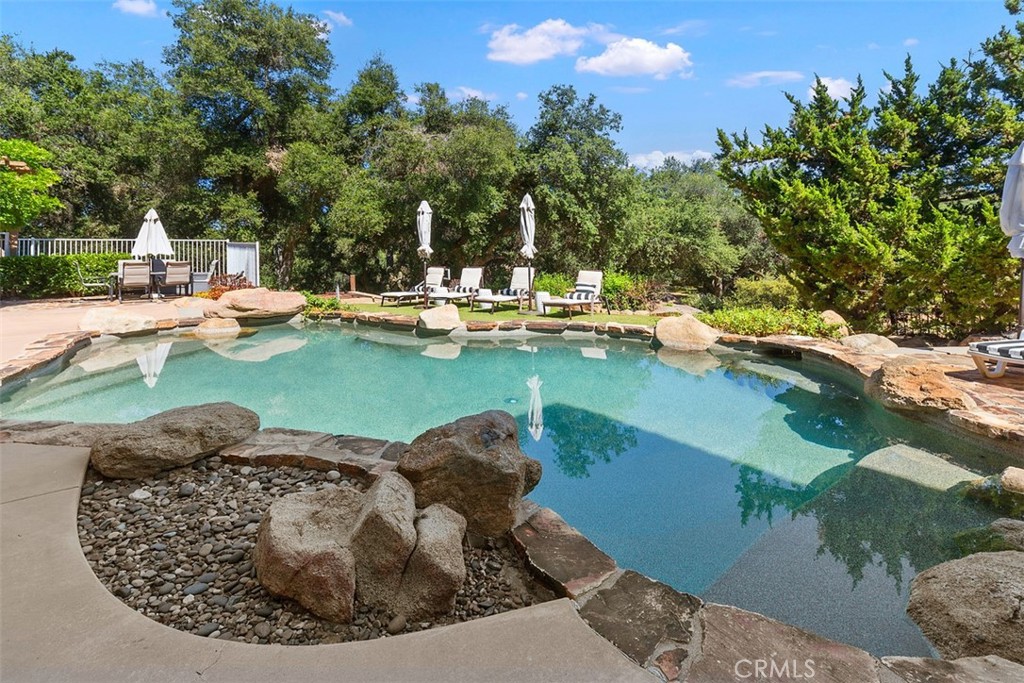 35455 El Niguel Road Lake Elsinore, CA 92530 - Photo 46 of 58 a view of a swimming pool with a sitting area