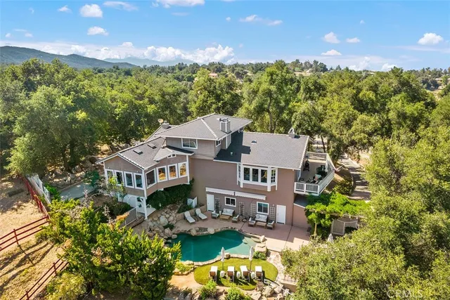 an aerial view of a house with a garden