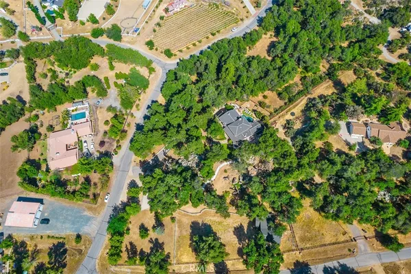 an aerial view of residential houses with yard