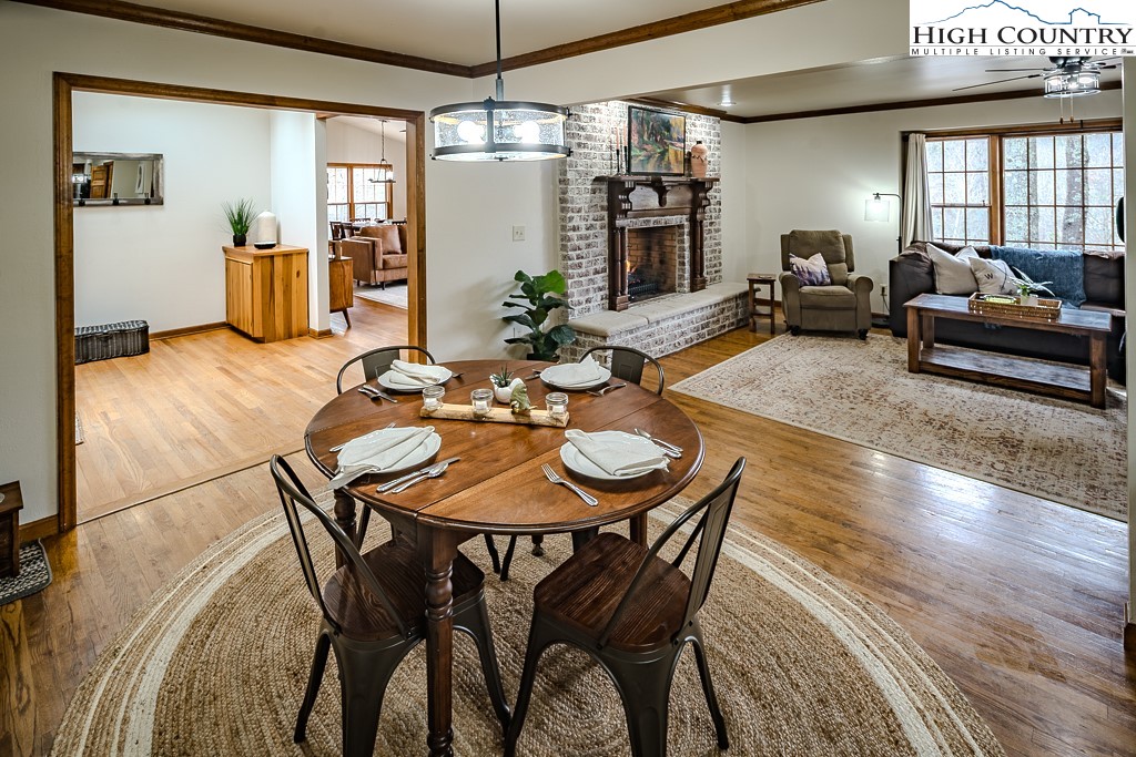 281 Old Hartley Road Banner Elk, NC 28604 - Photo 11 of 50 a view of a dining room with furniture window and wooden floor