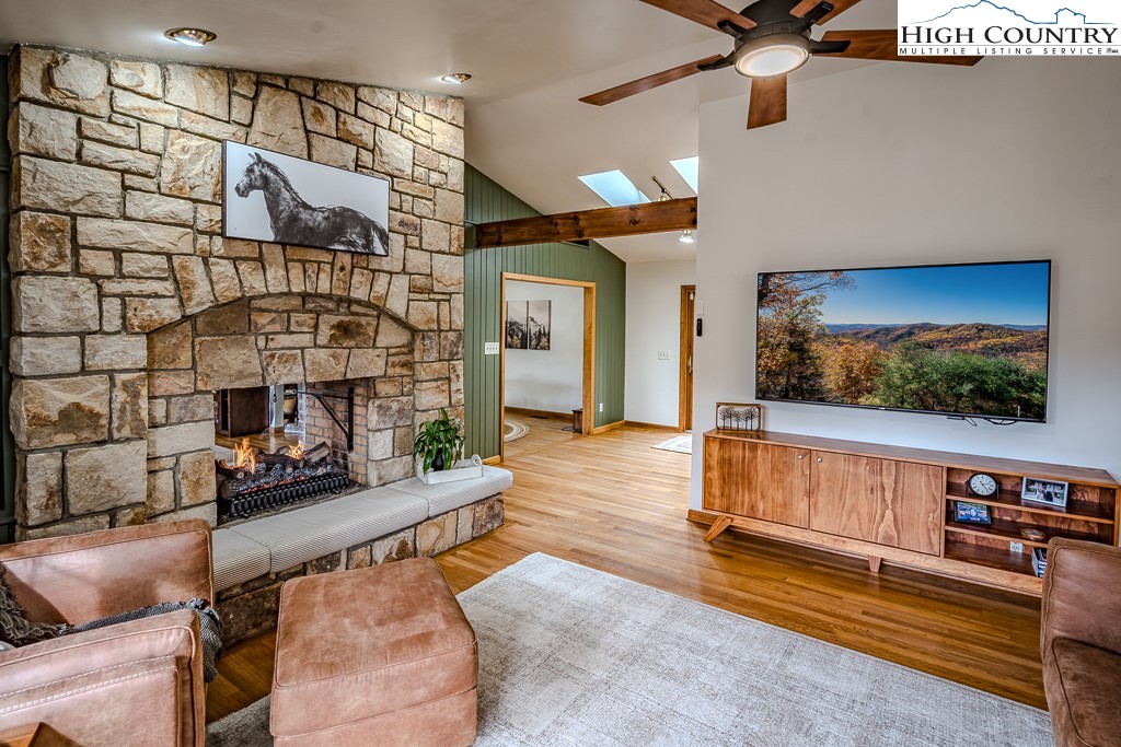 281 Old Hartley Road Banner Elk, NC 28604 - Photo 19 of 50 a living room with furniture and a flat screen tv