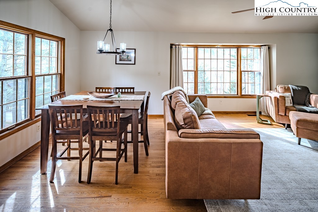 281 Old Hartley Road Banner Elk, NC 28604 - Photo 20 of 50 a view of a dining room with furniture window and wooden floor