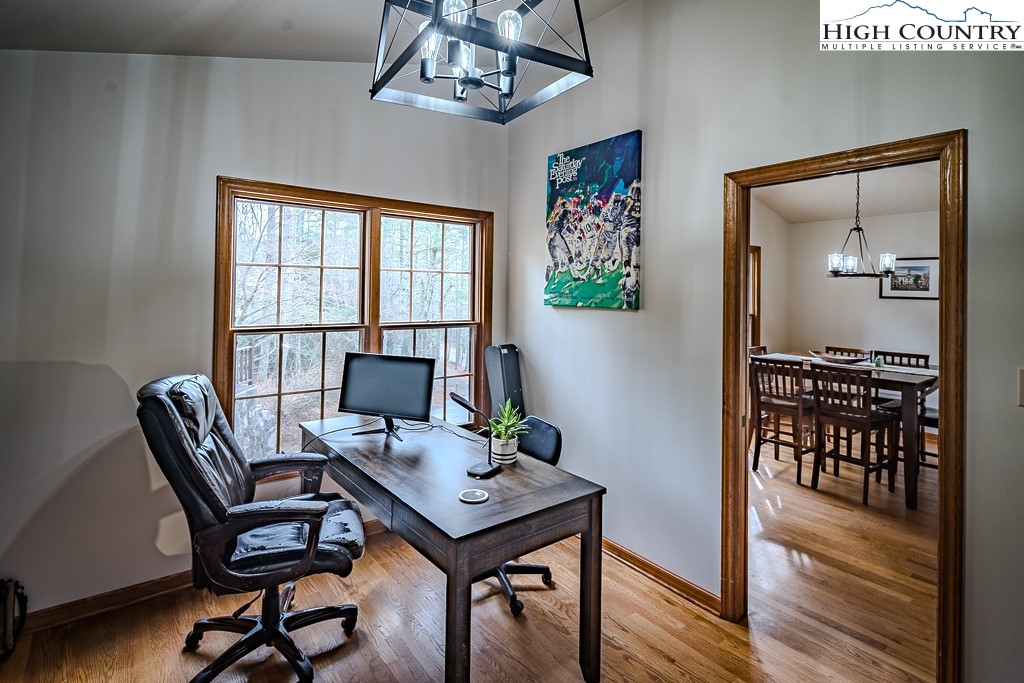 281 Old Hartley Road Banner Elk, NC 28604 - Photo 22 of 50 a view of a workspace with furniture and wooden floor