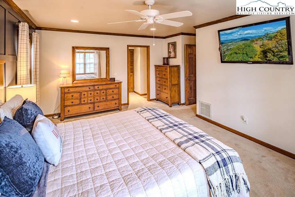 281 Old Hartley Road Banner Elk, NC 28604 - Photo 25 of 50 a bedroom with a bed and a dresser