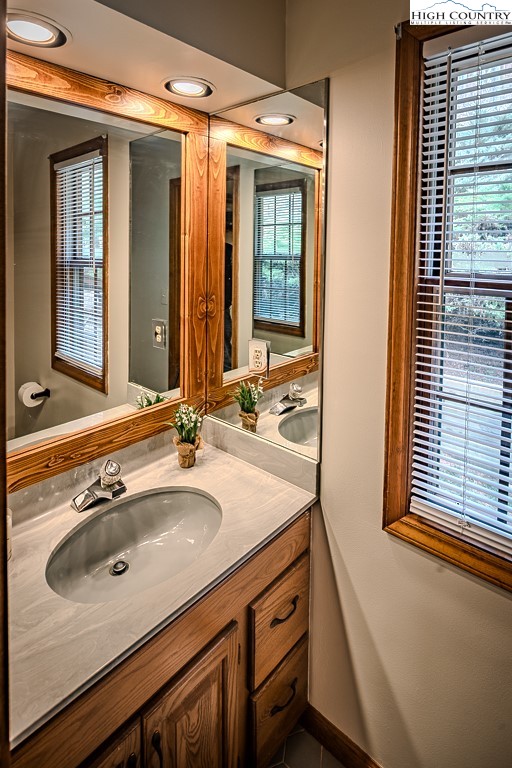 281 Old Hartley Road Banner Elk, NC 28604 - Photo 27 of 50 a bathroom with a sink double vanity and a mirror