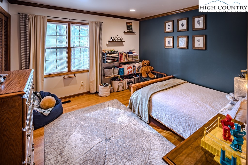 281 Old Hartley Road Banner Elk, NC 28604 - Photo 28 of 50 a bed room with a bed and a window