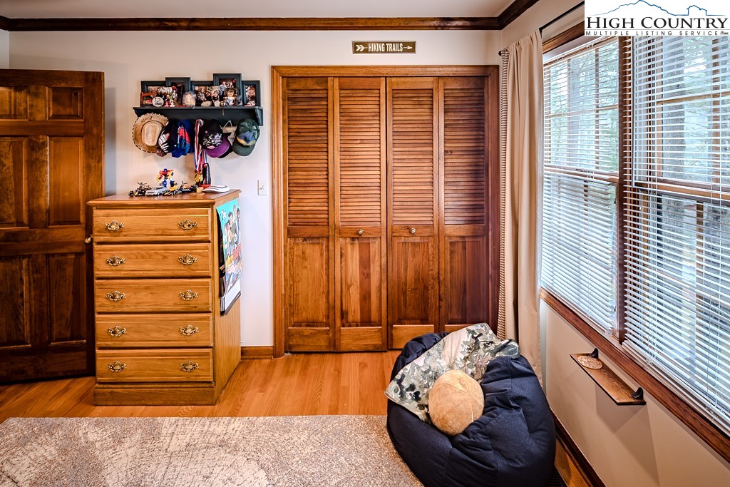 281 Old Hartley Road Banner Elk, NC 28604 - Photo 30 of 50 a view of a bedroom with clothes and shoes