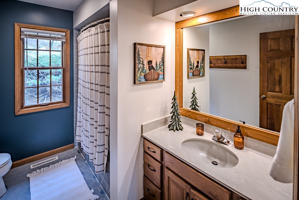 281 Old Hartley Road Banner Elk, NC 28604 - Photo 31 of 50 a bathroom with a sink and a mirror