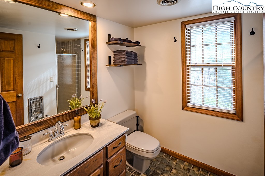 281 Old Hartley Road Banner Elk, NC 28604 - Photo 34 of 50 a bathroom with a sink toilet and mirror