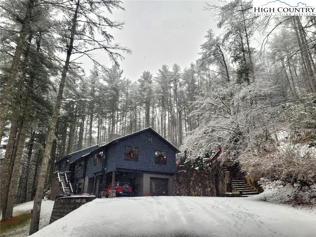 281 Old Hartley Road Banner Elk, NC 28604 - Photo 48 of 50 a front view of a house with a yard