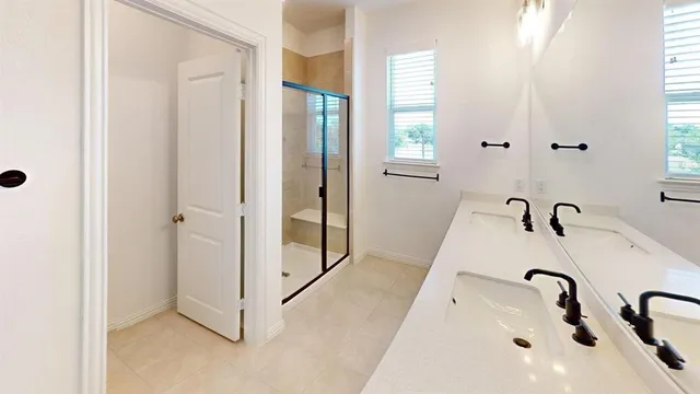 a bathroom with a bathtub and shower