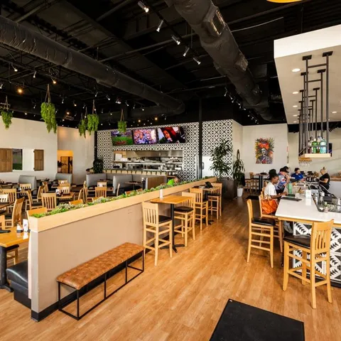 a living room with lots of furniture and a flat screen tv