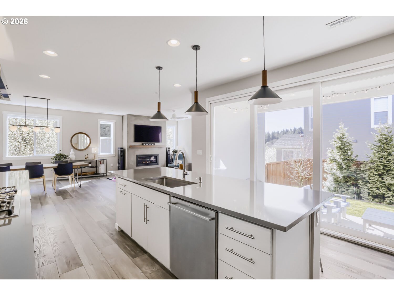 9957 Southwest 173rd Avenue Beaverton, OR 97007 - Photo 16 of 45 a open kitchen with sink and white cabinets with wooden floor
