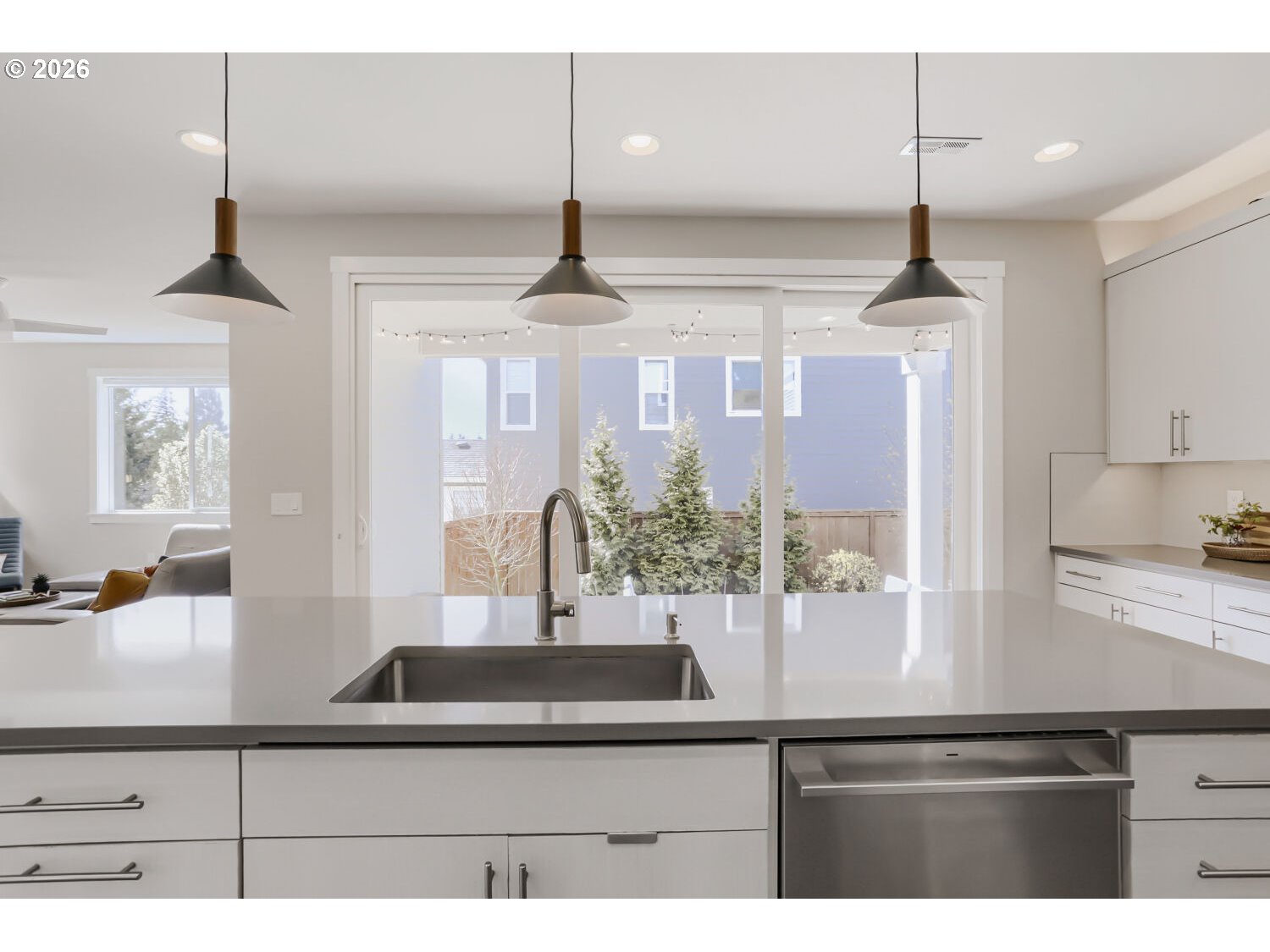 9957 Southwest 173rd Avenue Beaverton, OR 97007 - Photo 17 of 45 a kitchen with kitchen island stainless steel appliances a sink and cabinets