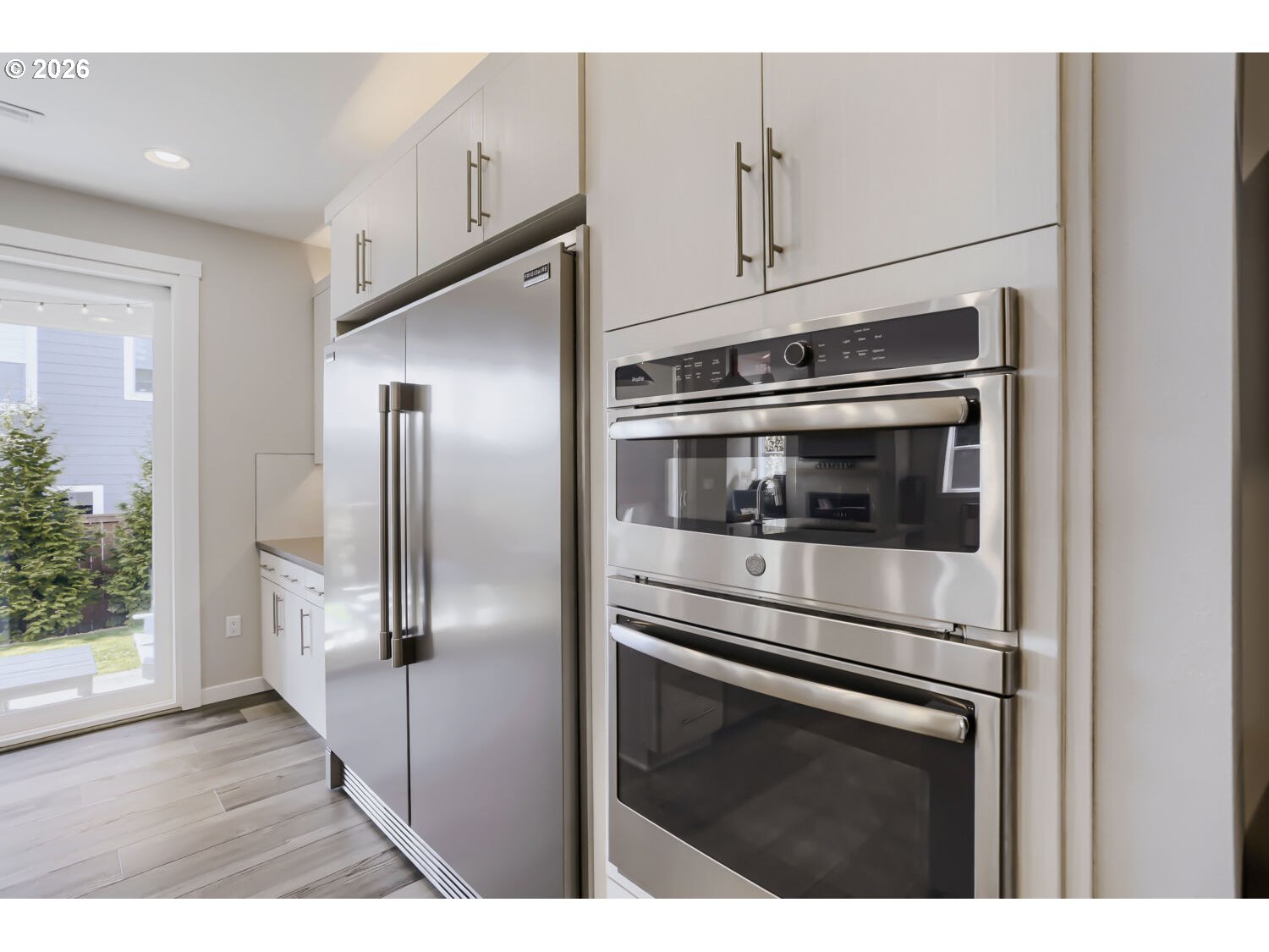 9957 Southwest 173rd Avenue Beaverton, OR 97007 - Photo 18 of 45 a kitchen with stainless steel appliances a refrigerator and a sink