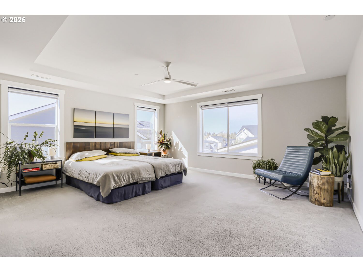 9957 Southwest 173rd Avenue Beaverton, OR 97007 - Photo 23 of 45 a spacious bedroom with a bed and a couch