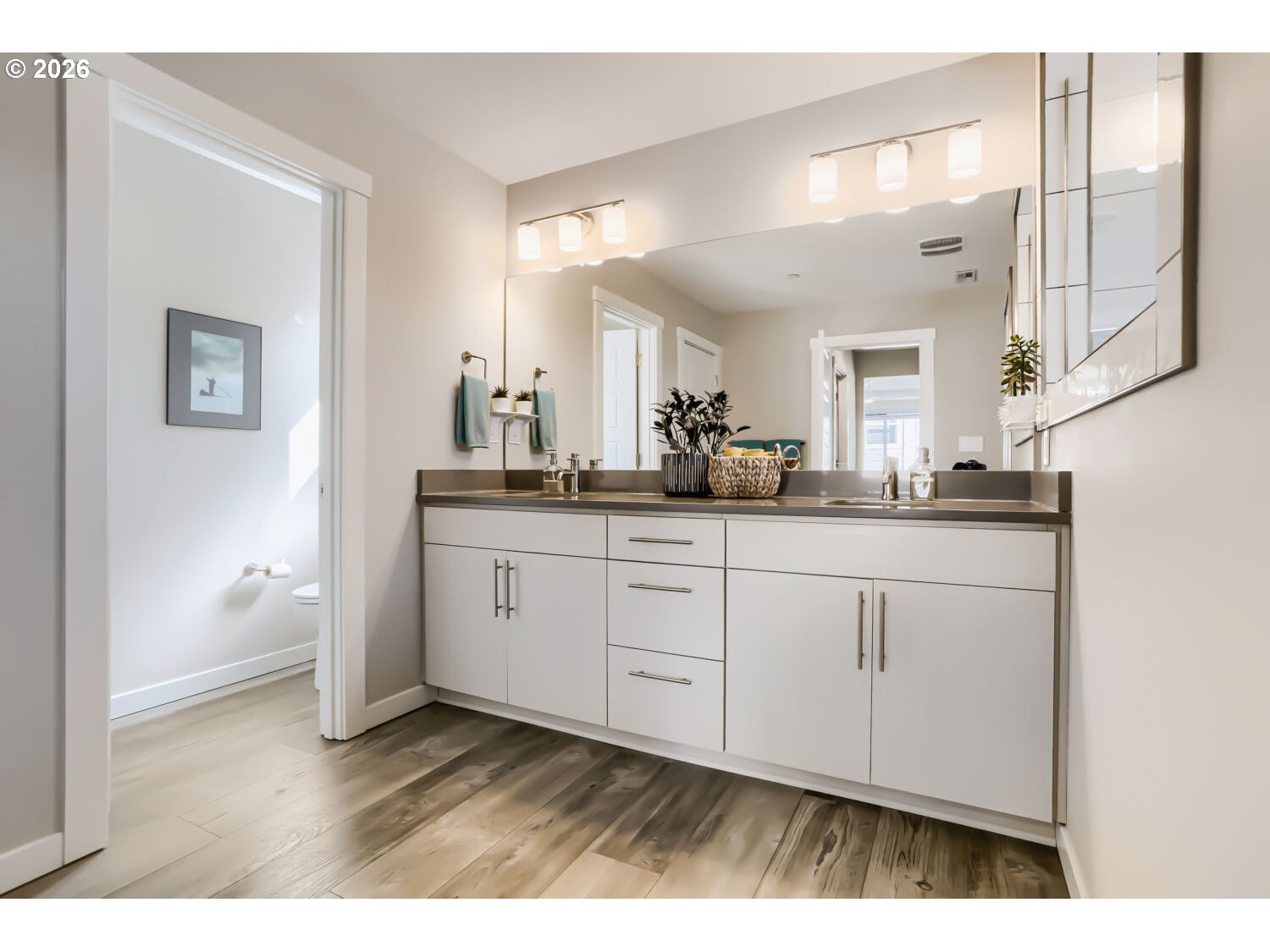9957 Southwest 173rd Avenue Beaverton, OR 97007 - Photo 27 of 45 a bathroom with a sink and a mirror