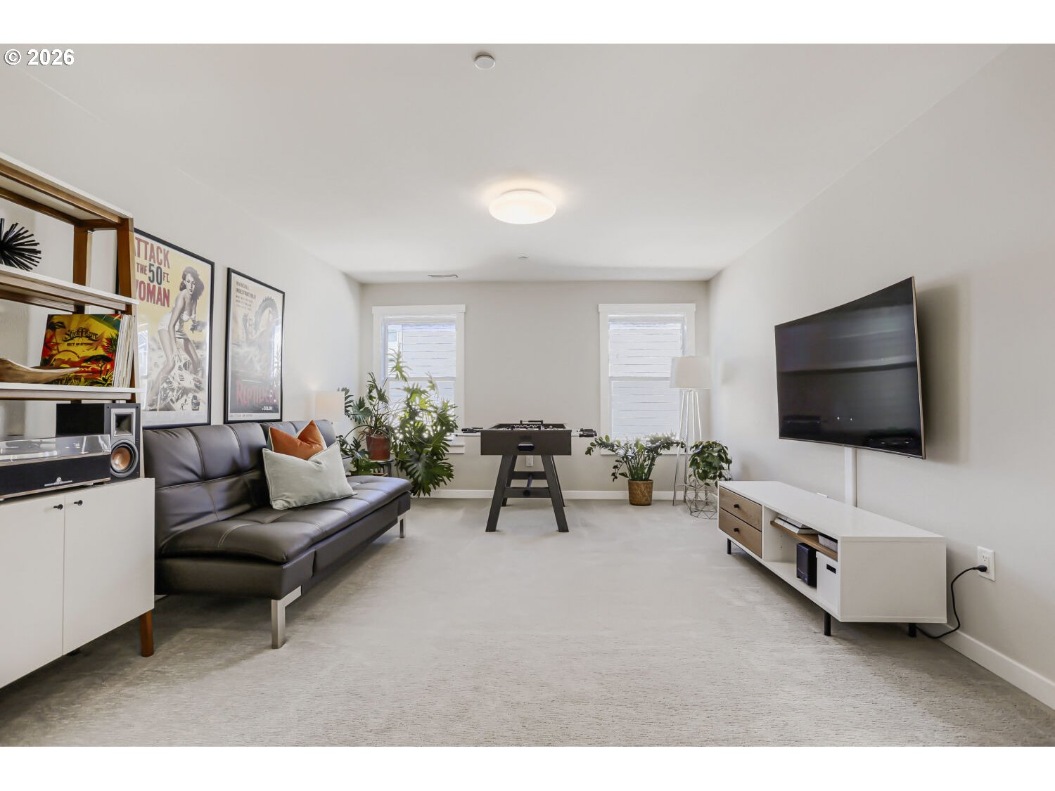 9957 Southwest 173rd Avenue Beaverton, OR 97007 - Photo 30 of 45 a living room with furniture and a flat screen tv