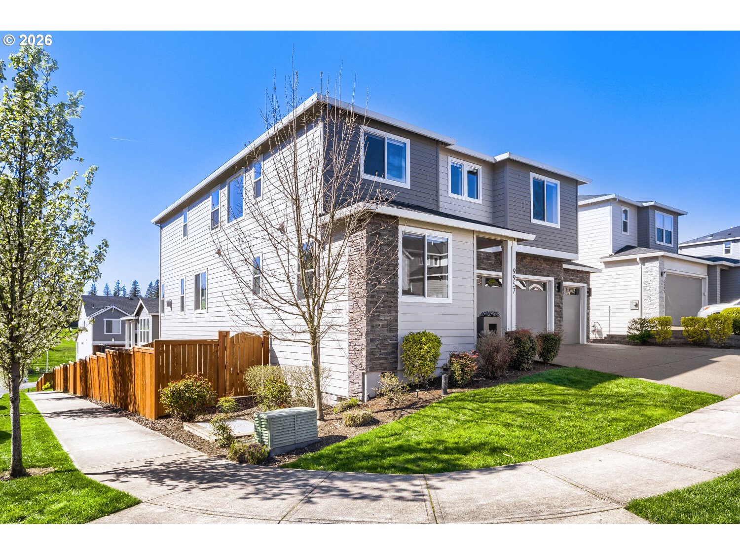 9957 Southwest 173rd Avenue Beaverton, OR 97007 - Photo 3 of 45 a front view of a house with garden