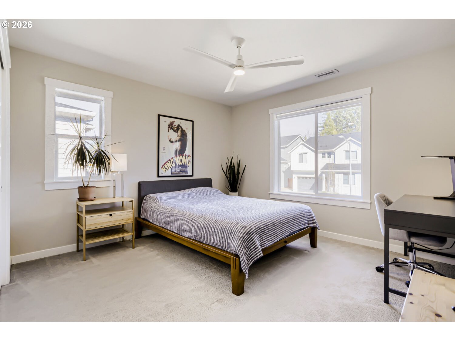 9957 Southwest 173rd Avenue Beaverton, OR 97007 - Photo 32 of 45 a bedroom with a bed and a table in it with window