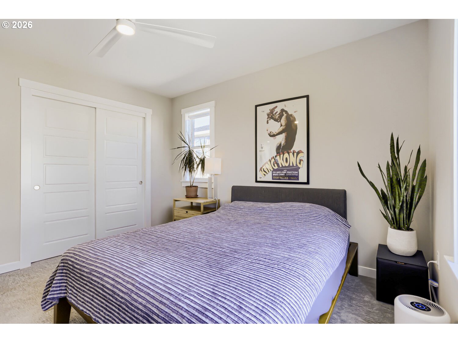 9957 Southwest 173rd Avenue Beaverton, OR 97007 - Photo 33 of 45 a bedroom with a bed a dresser and a window
