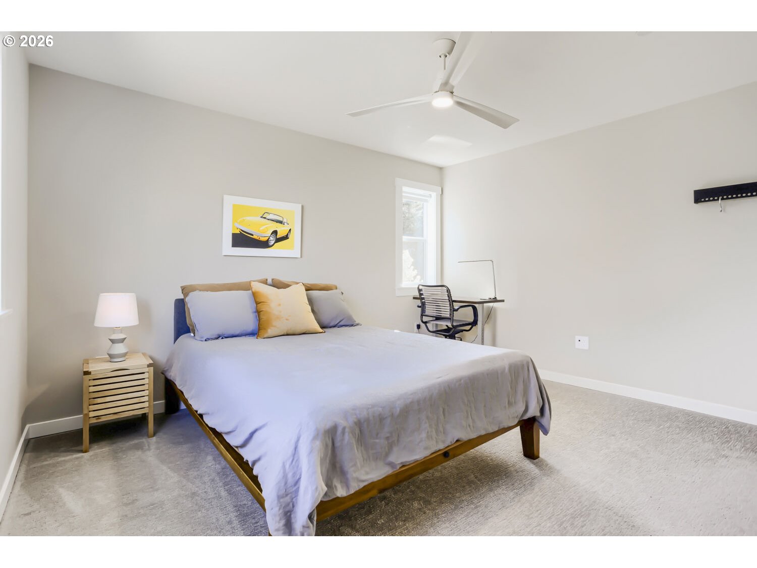 9957 Southwest 173rd Avenue Beaverton, OR 97007 - Photo 35 of 45 a bedroom with a bed and a lamp