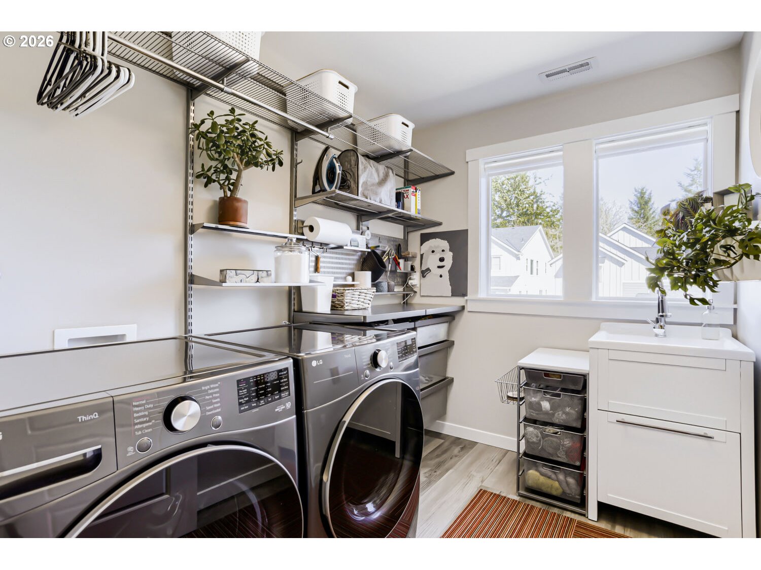 9957 Southwest 173rd Avenue Beaverton, OR 97007 - Photo 39 of 45 a utility room with dryer washer and a window