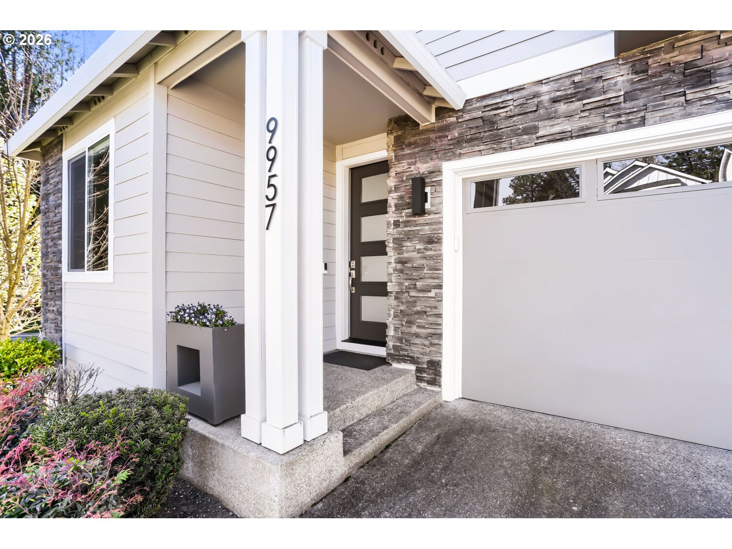 9957 Southwest 173rd Avenue Beaverton, OR 97007 - Photo 4 of 45 a view of a porch with wooden floor and a large window