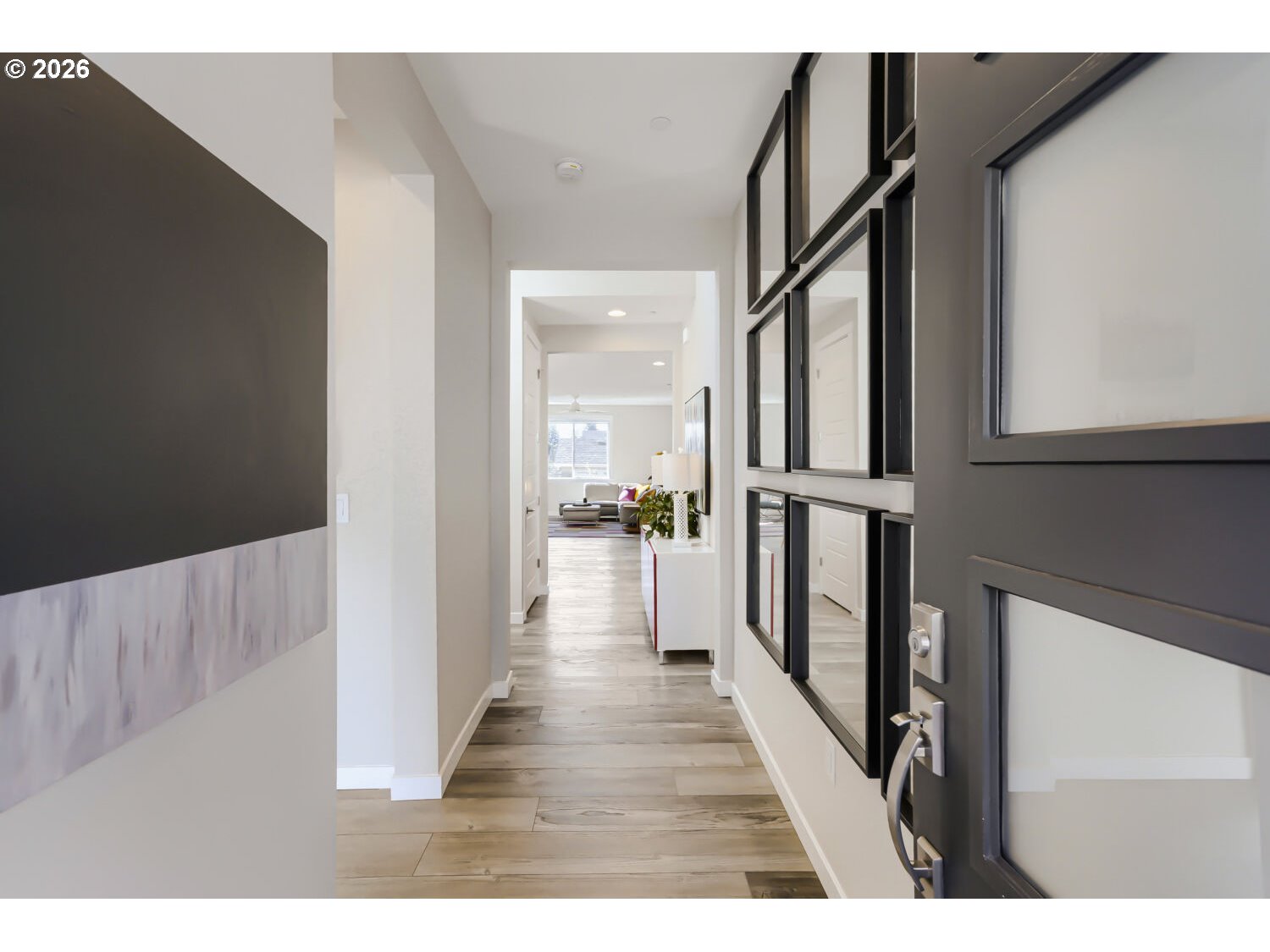 9957 Southwest 173rd Avenue Beaverton, OR 97007 - Photo 5 of 45 a view of hallway with wooden floor