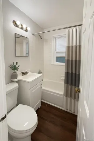a bathroom with a toilet a sink and a bathtub