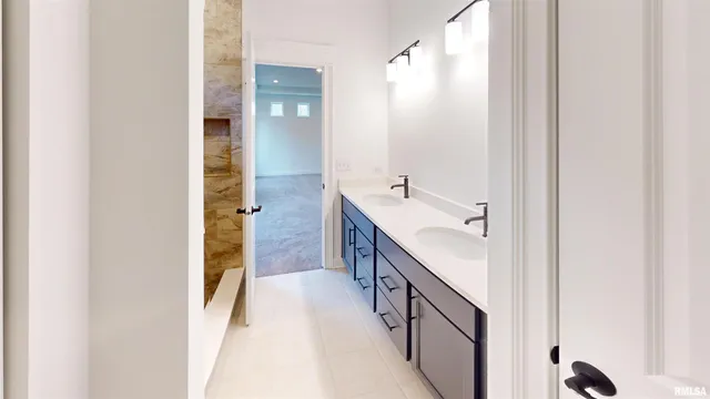 a bathroom with a double vanity sink and mirror