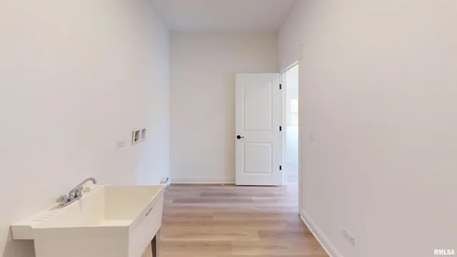 a bathroom with a sink and shower