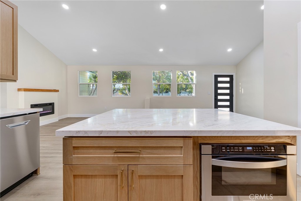700 West 10th Street Azusa, CA 91702 - Photo 11 of 43 a kitchen with granite countertop cabinets and window
