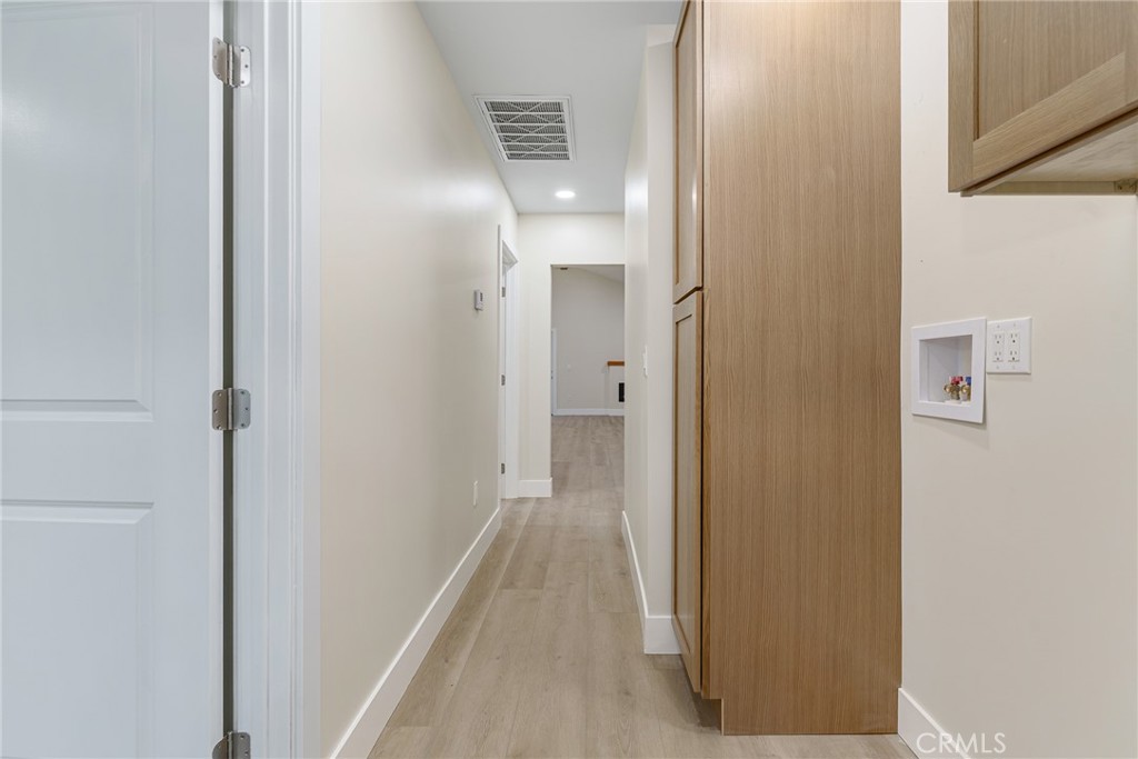 700 West 10th Street Azusa, CA 91702 - Photo 13 of 43 a view of a hallway with wooden floor